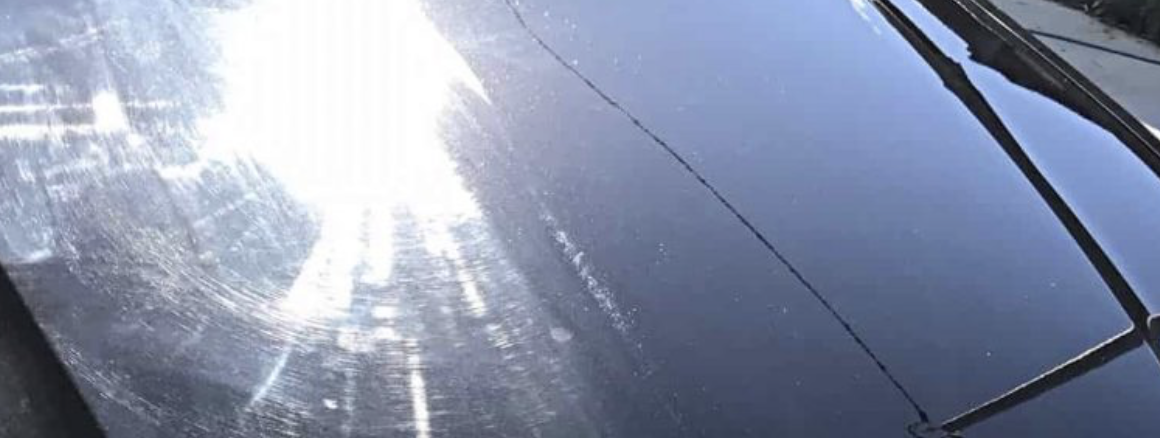 Vehicle hood with a visibly swirled finish on the left and a clearer finish on the right
